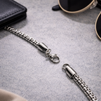 Silver dragon pendant on a chain from Encliff, featuring detailed dragon design and polished finish.