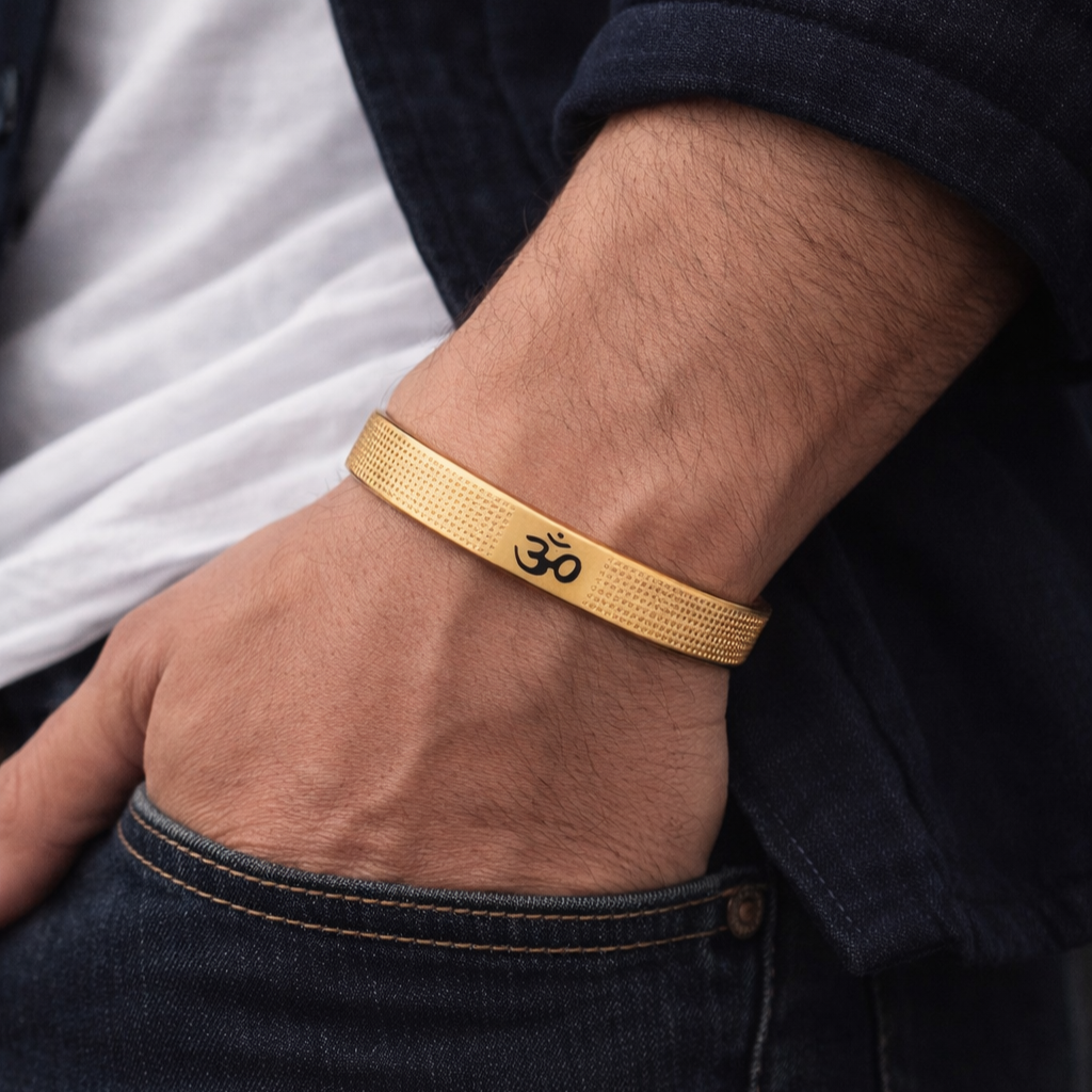 Silver OM Design bracelet by Encliff featuring intricate OM symbol and textured band on a neutral background.